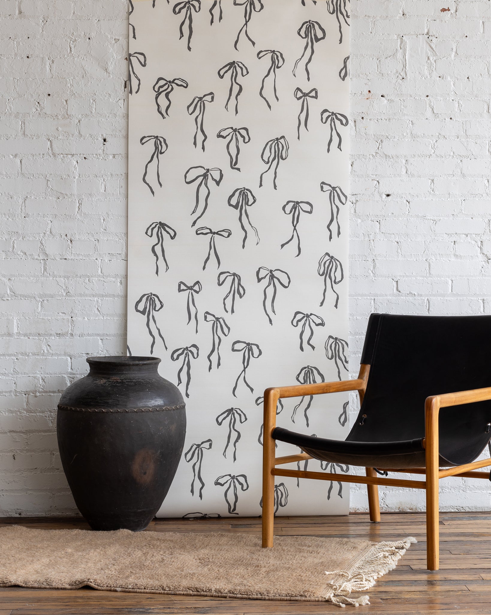 Illustrative bow wallpaper in Ink color - silk finish for classic and bold interior designs