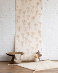 Walnut colorway of Bows wallpaper - sophisticated bow motif on a silk wallpaper base