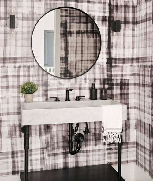 Bold abstract painted plaid wallpaper in a farmhouse style bathroom