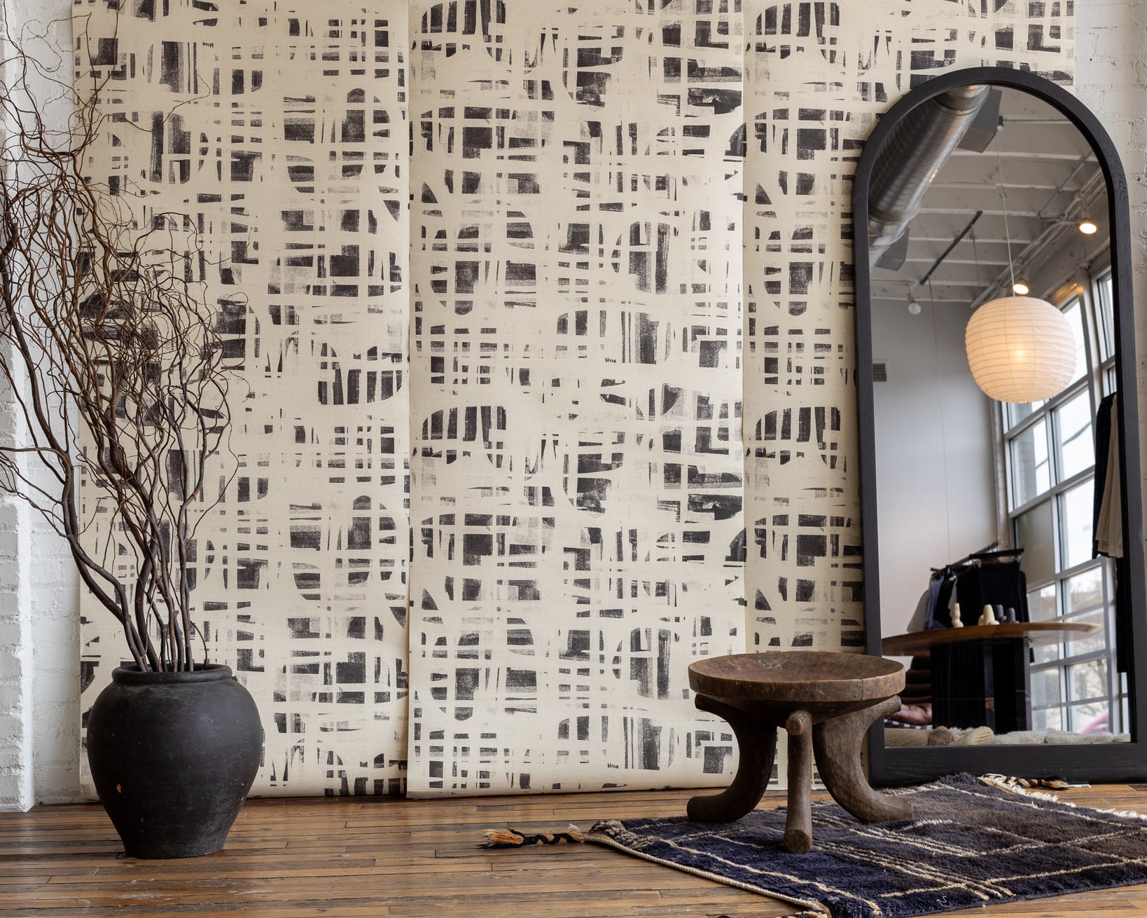 Poppy Monoprint Bone Grasscloth Wallpaper - Neutral Modern Geometric Grasscloth Design, Styled with Rustic Black Vase, Ideal for Sophisticated Interiors