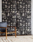 Monoprint Charcoal Grasscloth Wallpaper - Bold Dark Geometric Grasscloth Wallpaper for Dramatic Accent Walls, Styled with a Vintage Lounge Chair